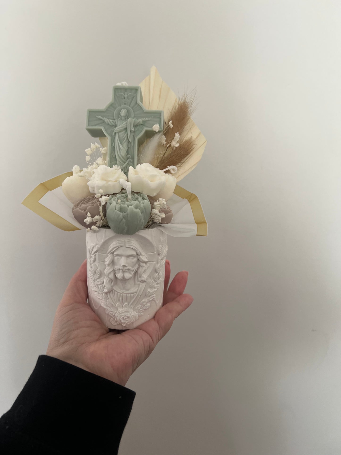 Religious gifts vase with candle bouquet