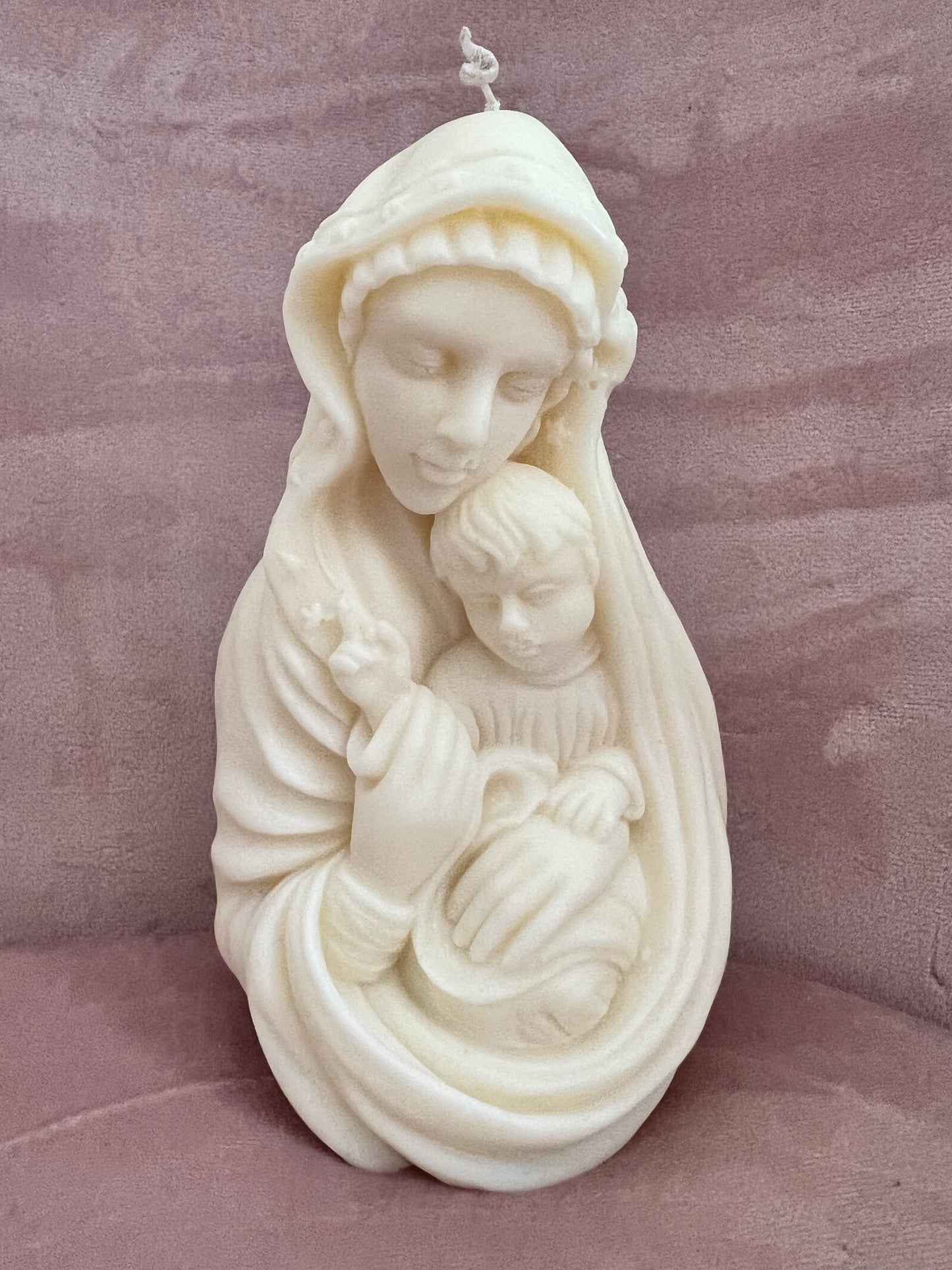 Mary with baby Jesus candle